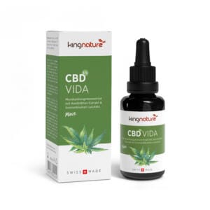 BoxBottle_CBDVida_De copy Eine grün-weiße Schachtel und eine Tropfflasche mit der Aufschrift „CBD Vida“, auf der Hanfblätter, deutscher Text und eine Schweizer Flagge abgebildet sind und die hervorhebt, dass dieses Produkt mit Minzgeschmack in der Schweiz hergestellt wird.