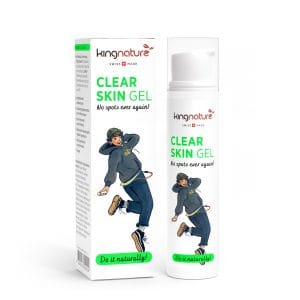 Eine Schachtel und eine Tube Kingnature Clear Skin Gel. Beide zeigen die Illustration einer fröhlich hüpfenden Person in Freizeitkleidung. Auf der Verpackung steht: Clear Skin Gel – Nie wieder Pickel! Natürlich! Schweizer Hautpflege.